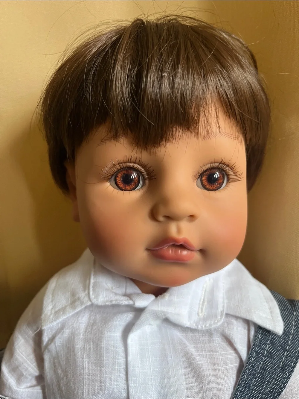 Realistic Baby Doll in Blue Denim Overalls with White Shirt